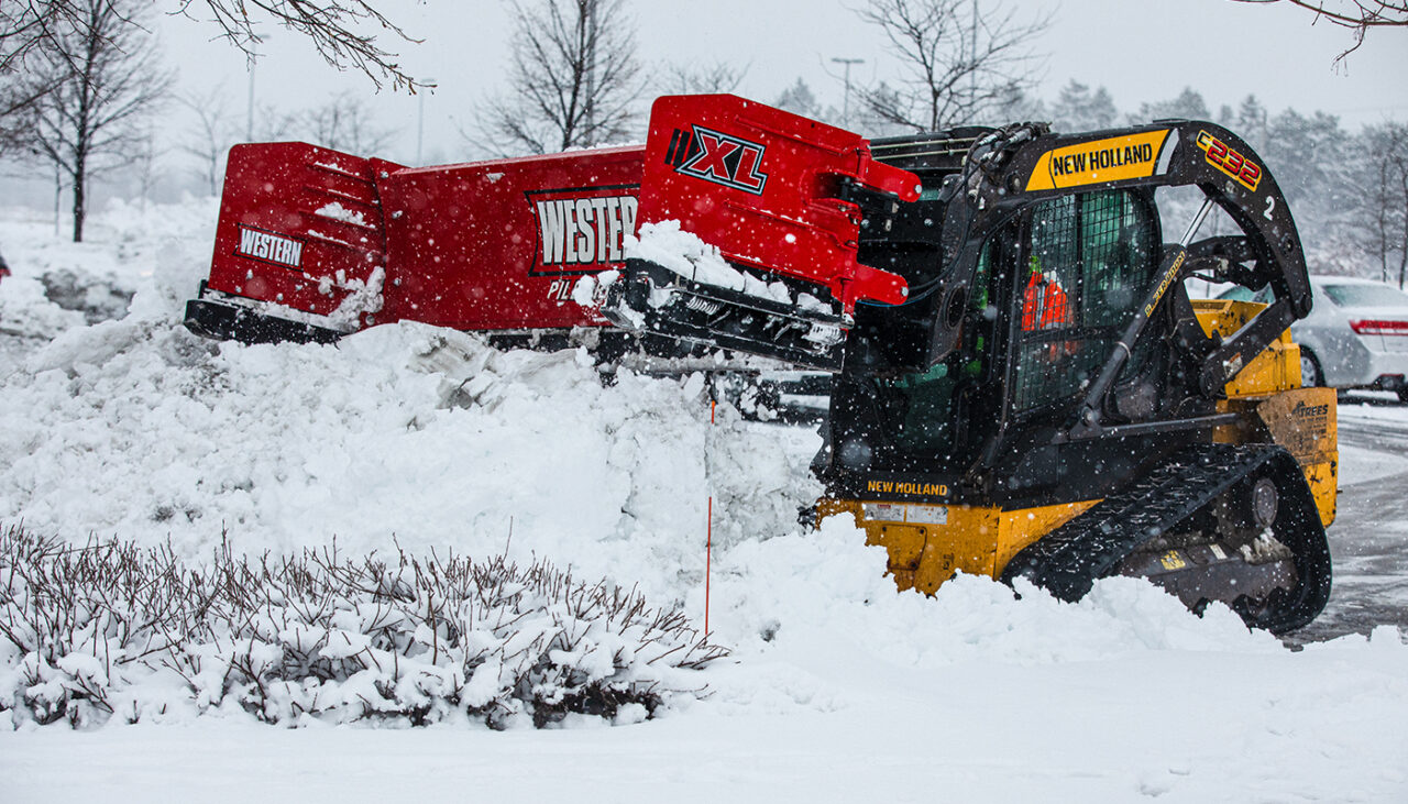 pile driver xl stacking snow with skidsteer