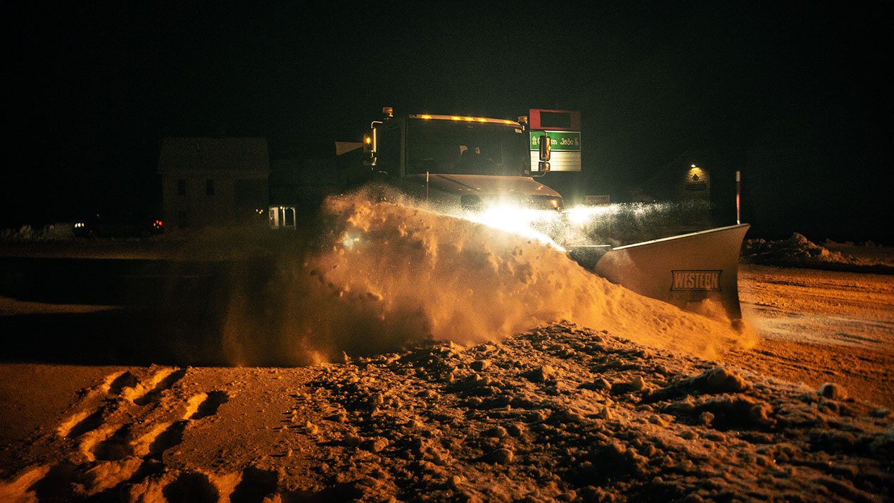 Plowing snow at night